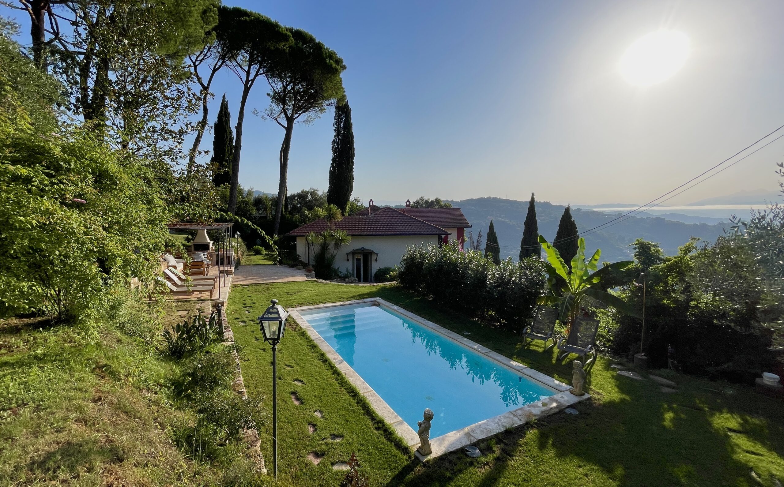 Private swimming pool at luxury villa in La Spezia with Mediterranean garden